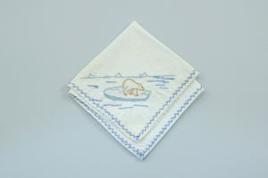 Image: A polar bear on an ice floe, one of a set of 4 embroidered napkins, each with different outdoor activity 